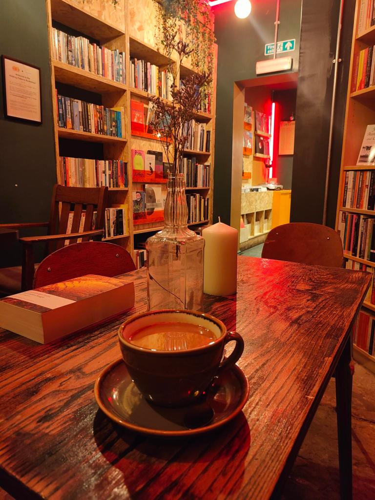 Books On Shelves and Coffee